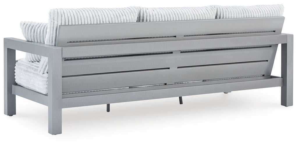 Hurley Park light gray outdoor sofa rear view with striped cushions and pillows