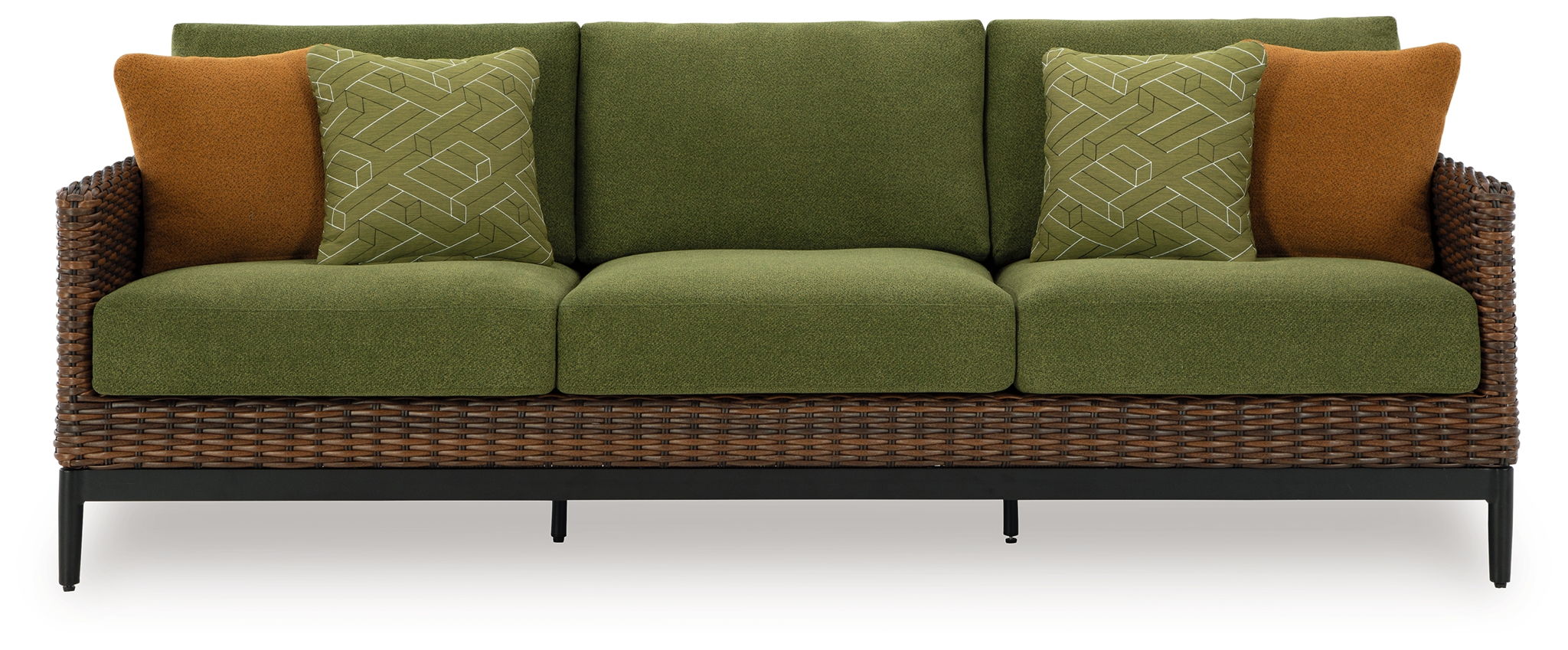 Three-seat wicker sofa with green cushions, patterned green pillows, and brown accent pillows