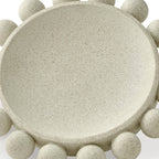 Beige stone-textured bowl with round top surface and pebble-like side rim