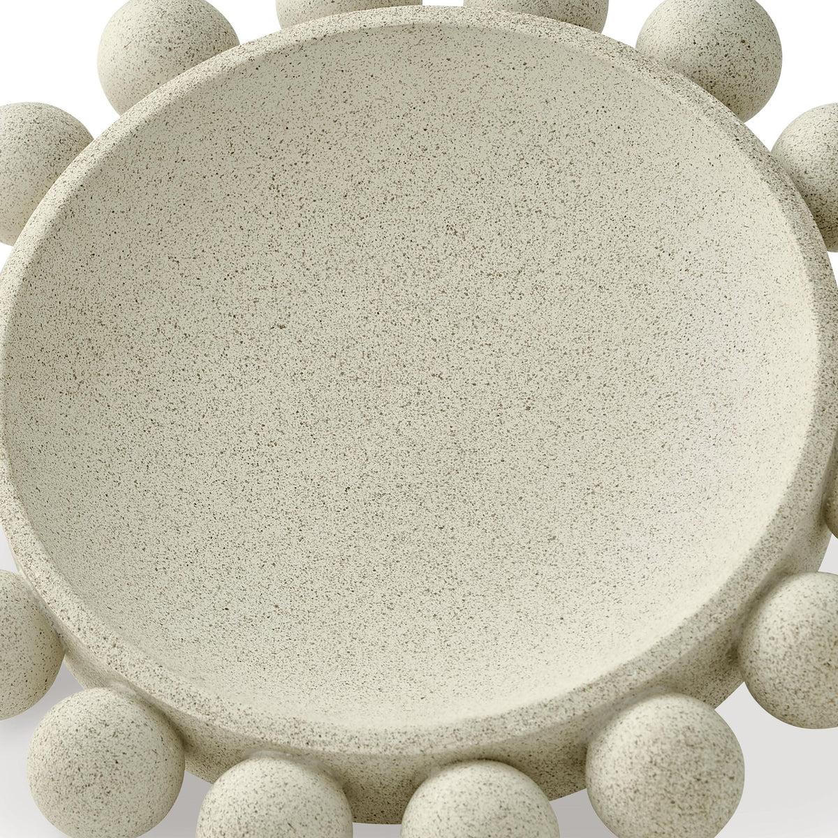 Beige stone-textured bowl with round top surface and pebble-like side rim