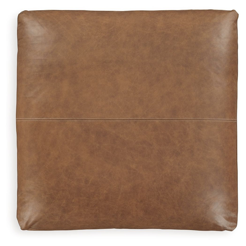 Light brown oversized accent ottoman with flat square back and stitched center seam
