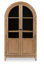 Light brown accent cabinet with arched glass doors and two interior shelves
