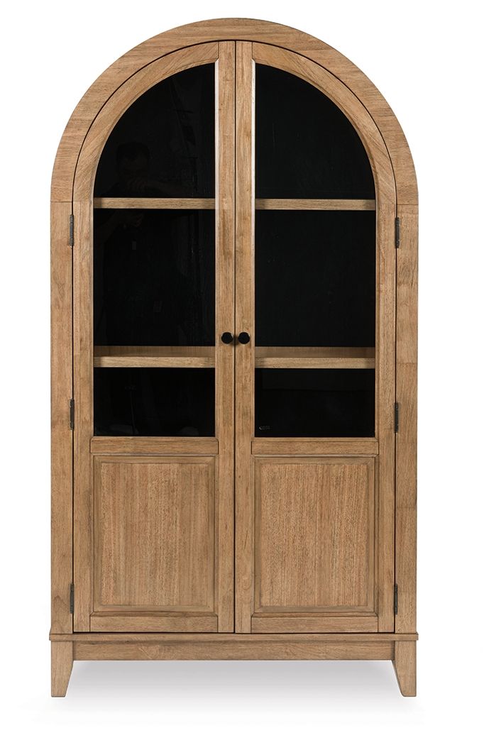 Light brown accent cabinet with arched glass doors and two interior shelves