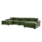 Green corduroy sectional sofa with long chaise and multiple back pillows