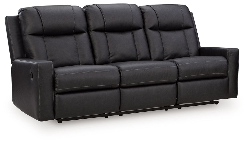 Black reclining sofa with padded, tufted back cushions and segmented seat sections
