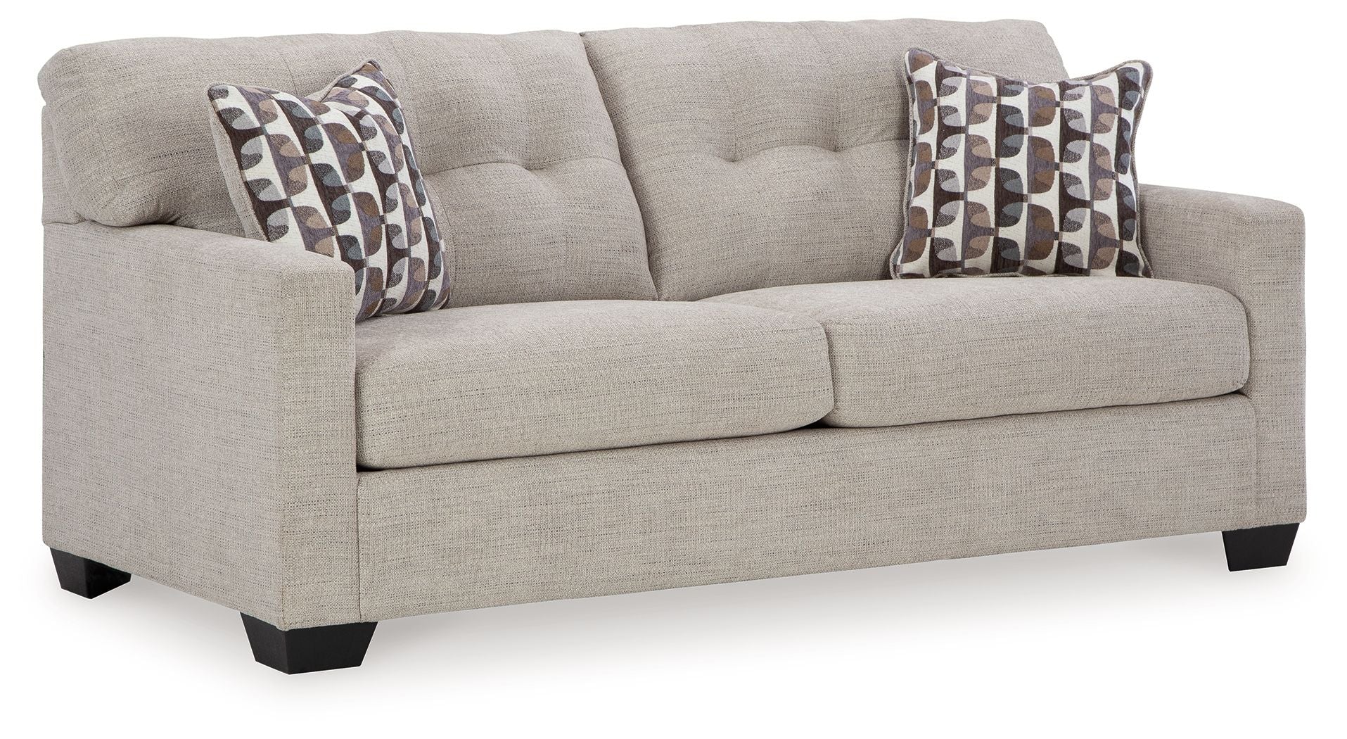 Light gray sofa with rolled arms and two patterned throw pillows