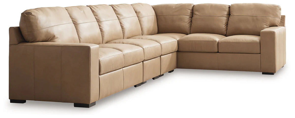 Two-tone sectional sofa with chaise seating, boxed arms, and tan-and-cream upholstery