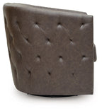 Brown swivel accent chair with button-tufted back panel and low rounded base