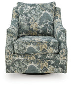 Green floral swivel accent chair with high back, rolled arms, and padded seat.