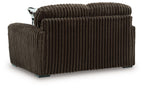 Dark brown corduroy loveseat with rounded arms and vertical channel stitching