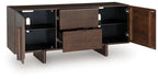 Medium brown accent cabinet with open shelves and center drawer, black pull hardware.