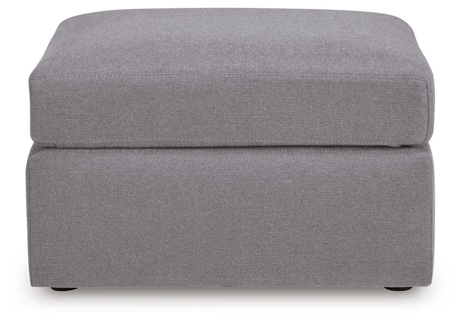 Gray accent ottoman with cushioned top and square base, low dark legs.