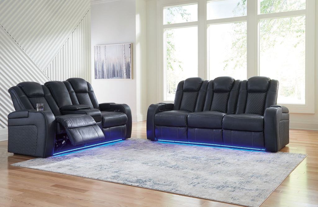 Dark gray reclining living room set with two recliner seats and blue-lit bases