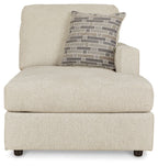 Pearl silver corner chaise with patterned lumbar pillow and upholstered arms