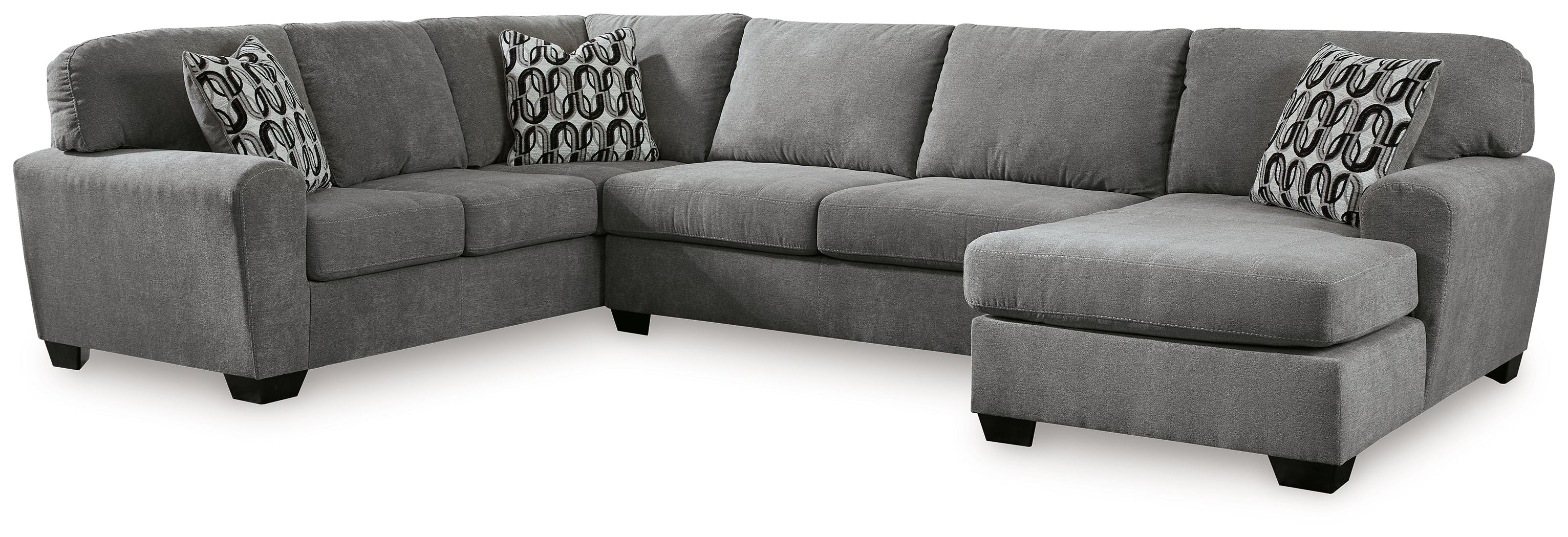 Gray sectional sofa with right-facing chaise and patterned throw pillows