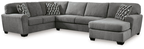 Gray sectional sofa with right-facing chaise and patterned throw pillows