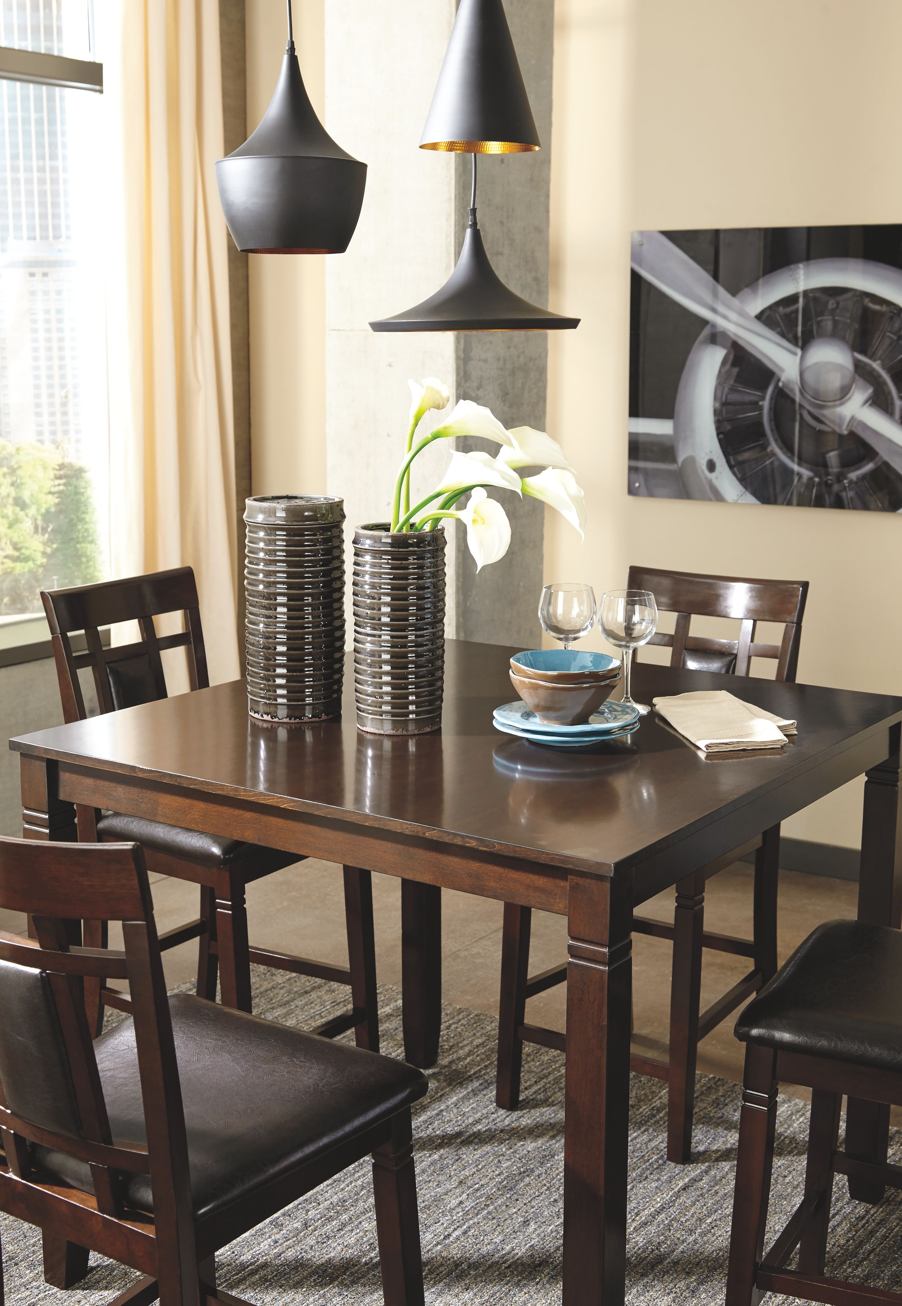Brown counter-height table with four matching chairs, set of five