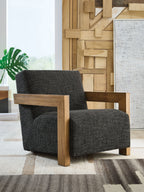 Charcoal fabric accent chair with broad back, wooden arms, and sturdy square base
