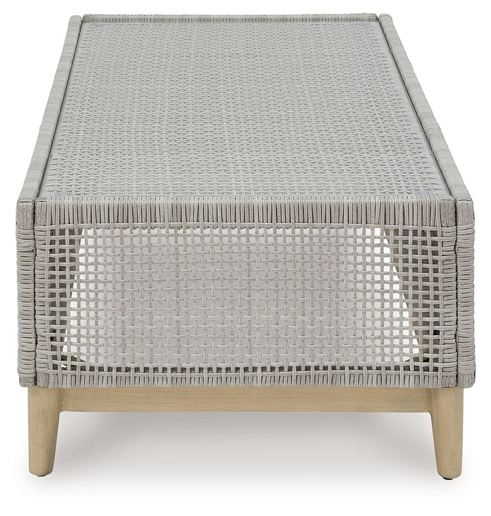 Gray rectangular cocktail table with woven mesh sides and flat tabletop