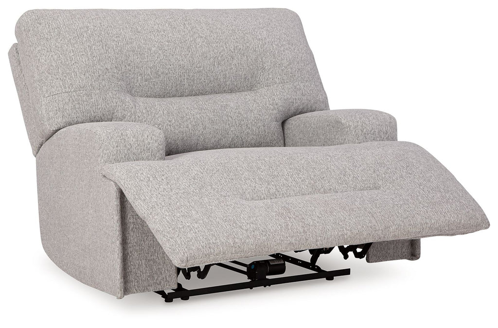 Wide seat power recliner in light gray with extended footrest and padded arms.