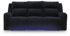 Power reclining sofa with adjustable headrests, black ribbed upholstery