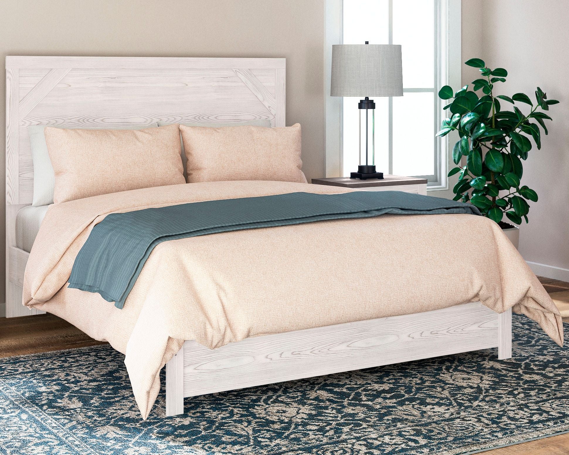 White panel bed with headboard, set with beige and teal bedding and two pillows