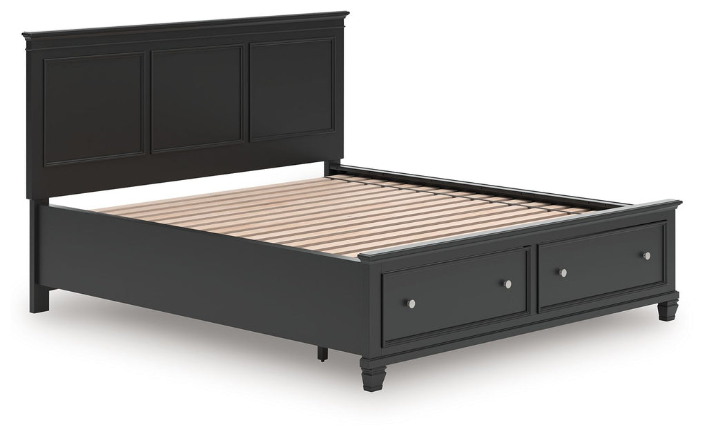 Black panel bed frame with slatted base and drawers along the footboard