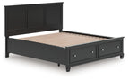Black panel bed frame with slatted base and drawers along the footboard