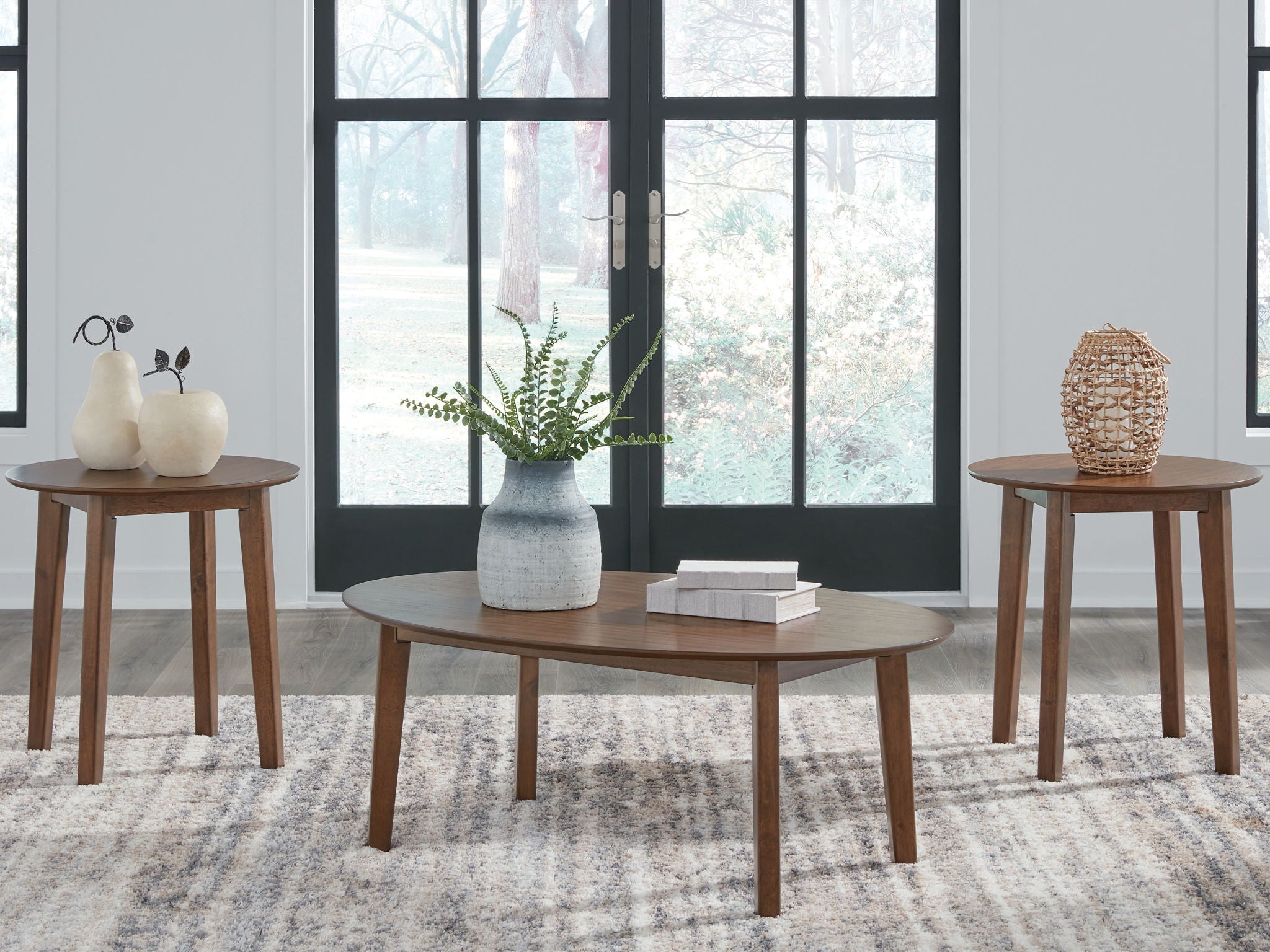 Wooden occasional table set with a round coffee table and two side tables, brown