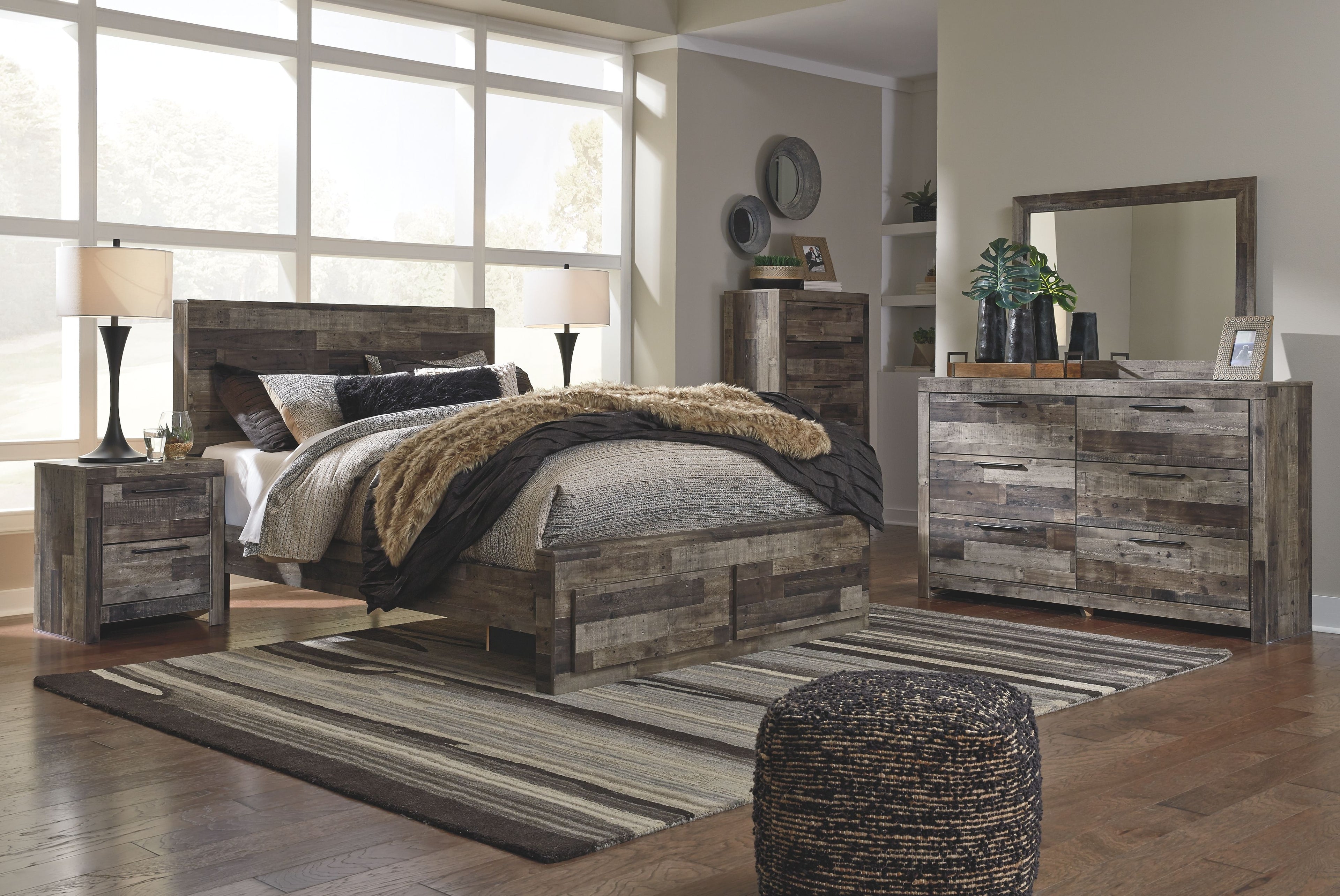 Panel bedroom set with panel bed, nightstand, and dresser with mirror in rustic gray wood.
