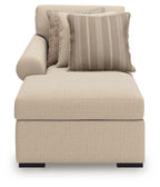 Light beige chaise lounge with three fabric cushions and padded backrest