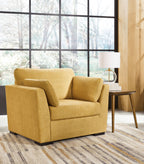 Yellow upholstered armchair with wide arms and tufted back cushion