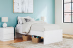 White platform bed with open side storage showing beneath-bed space