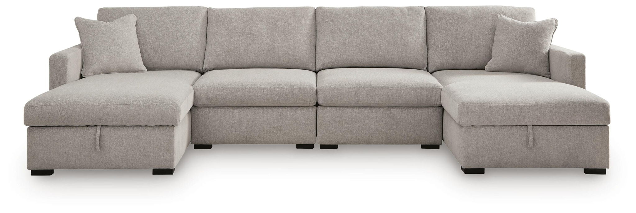 Gray sectional sofa with chaise ottomans on both ends and rounded back pillows