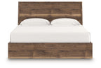 Dark brown panel bed with slatted headboard and white pillows on mattress