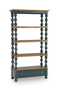 Blue and brown bookcase with three open shelves and a drawer base, turned pedestal legs