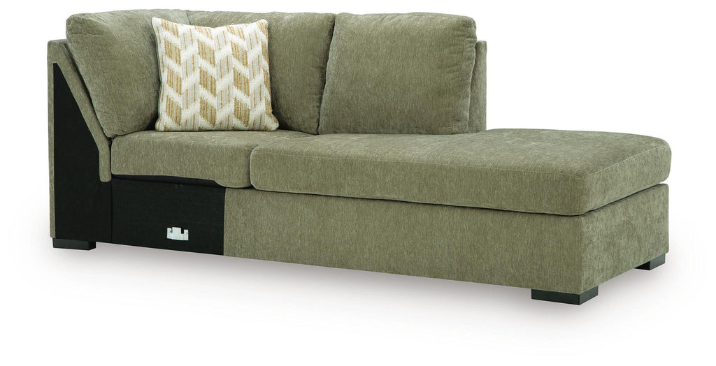 Green corner chaise with high back cushion, square arms, dark legs, and two pillows