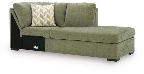 Green corner chaise with high back cushion, square arms, dark legs, and two pillows