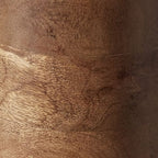 Wood lamp base close-up showing layered grain rings and dark brown finish