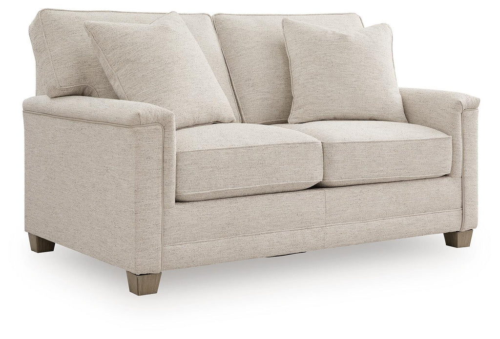 Light beige upholstered loveseat with rolled arms, three back cushions, two seat cushions