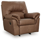 Caramel-brown upholstered rocker recliner with tufted back, curved arms, and wide seat