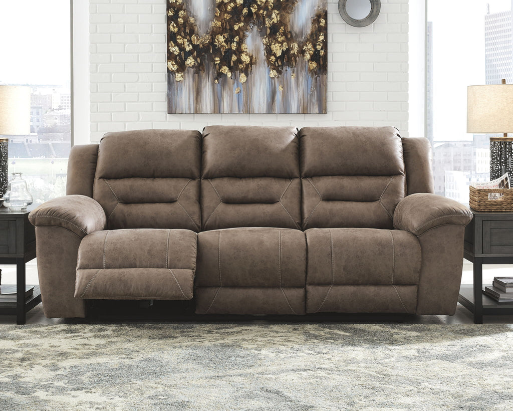 Power reclining sofa in dark brown plush fabric with padded arms