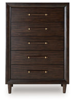 Five-drawer chest with brass bar pulls on a dark wood front panel