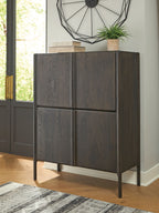 Dark espresso brown accent cabinet with four panel doors and tapered metal legs