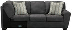 Slate gray RAF sofa with two chevron throw pillows