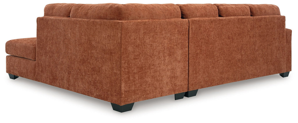 Rust-brown fabric sectional sofa with corner chaise and clean-lined cushions