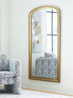 Arched floor mirror with slim gold frame and reflective glass panel