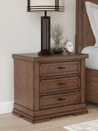 Medium brown three-drawer night stand with three bar-pull drawers