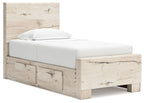 Light beige panel storage bed with upholstered headboard and drawer-front storage