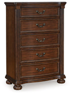 Brown five-drawer wooden chest with ornate metal handles and turned bun feet